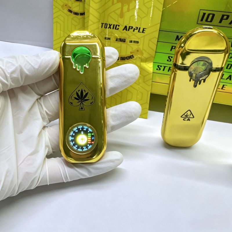 Handheld Empty Ace Ultra V6 gold disposable vape pen showcasing the active circular LED screen.