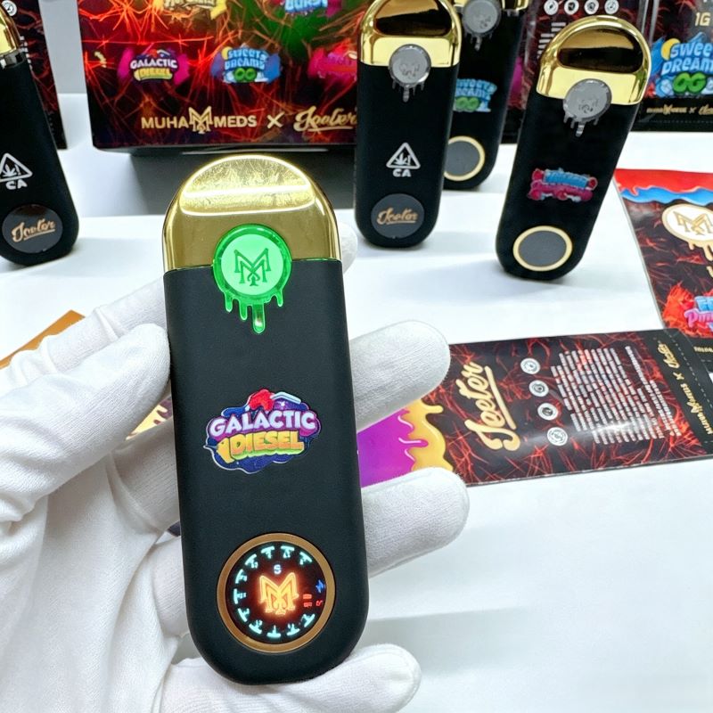 Front view of Muha Meds x Jeeter empty vape device featuring screen display and gold mouthpiece