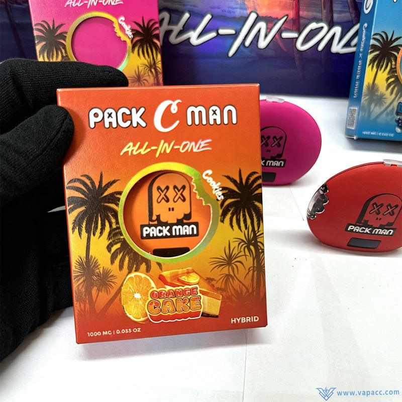 Hand holding Orange Cake flavor box for Packman x Cookies 1g empty disposable vape